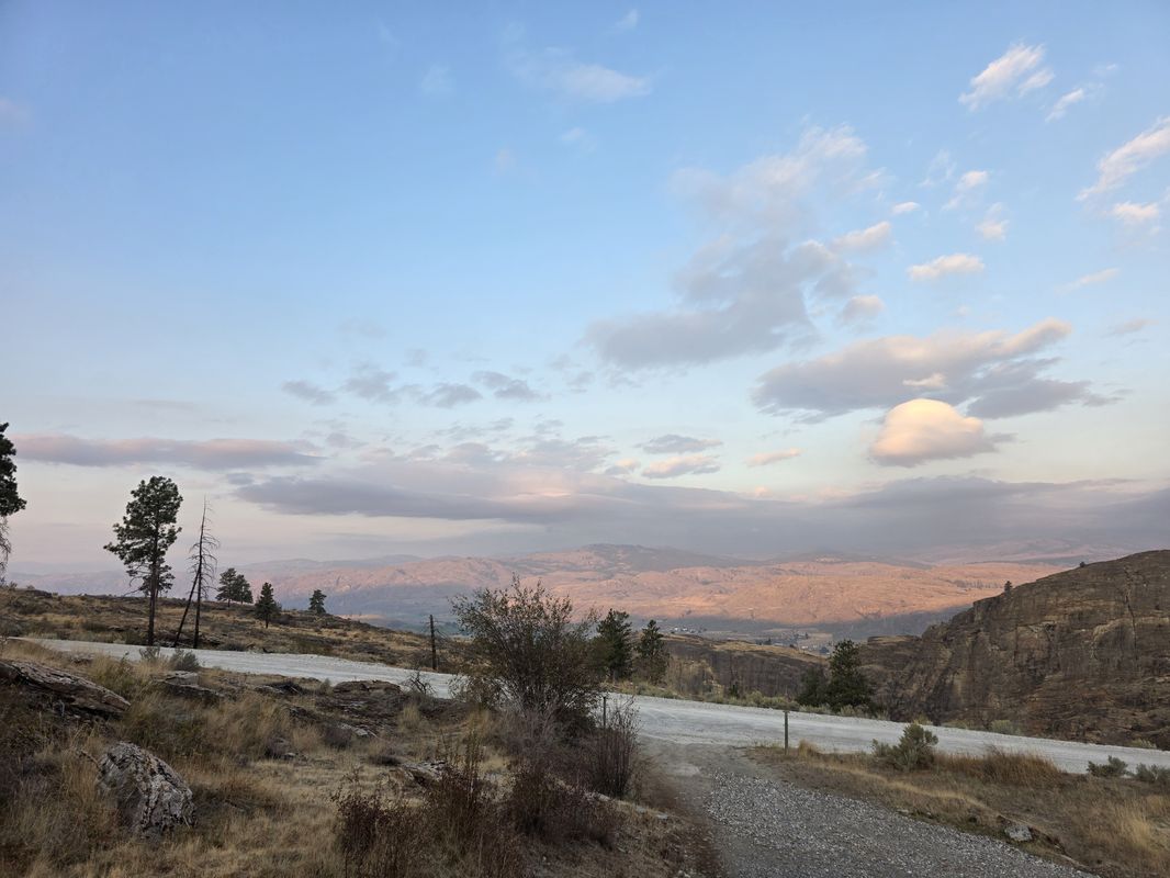 Okanogan Valley at dawn in September, showing the highway corridor leading toward McLaughlin Canyon
